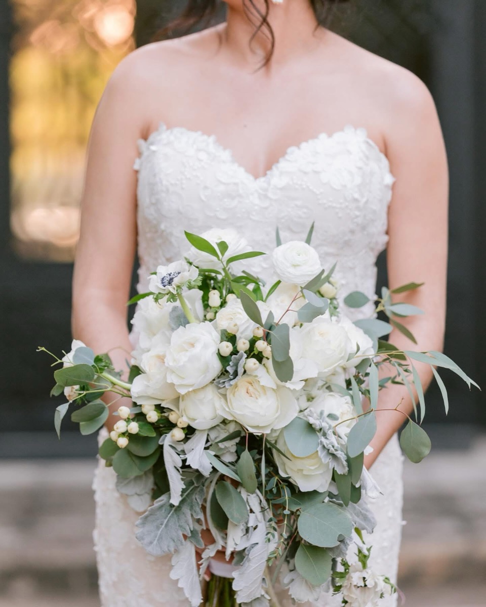 Bride holding a white floral bouquet