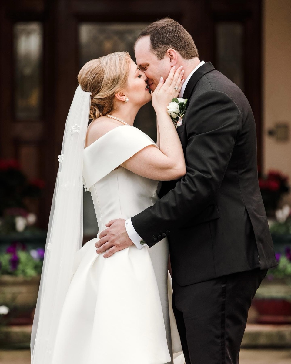 Bride and groom kissing during the reception